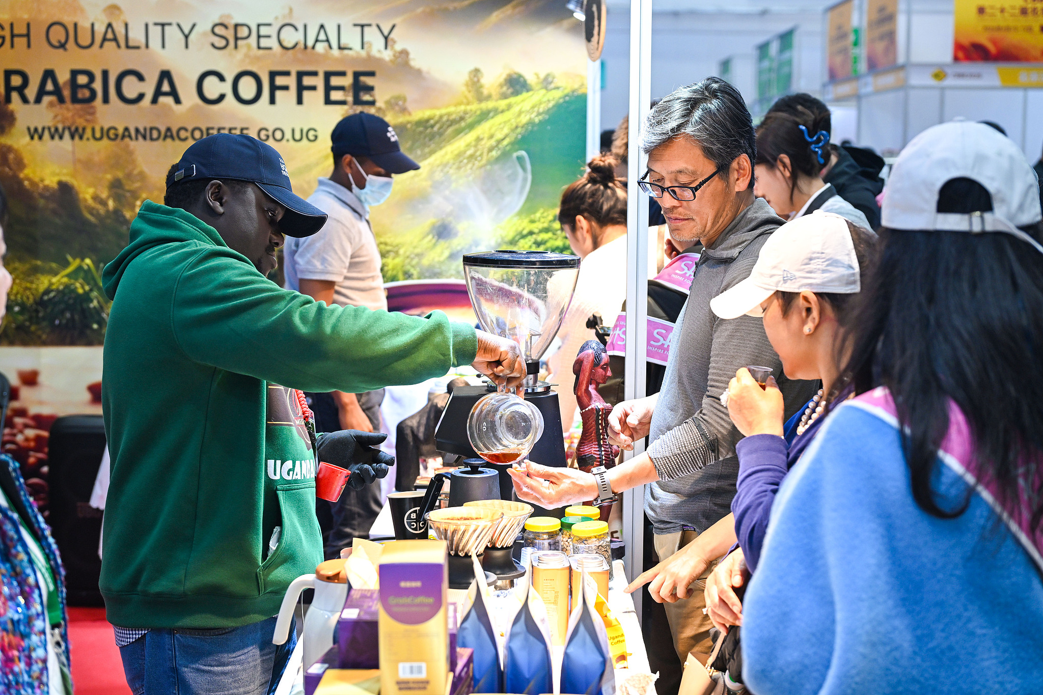 Visitors sample Ugandan coffee during the 13th Beijing International Hospitality, Catering, and Food Beverage Exhibition, in Beijing, China, April 10, 2026. /CFP
