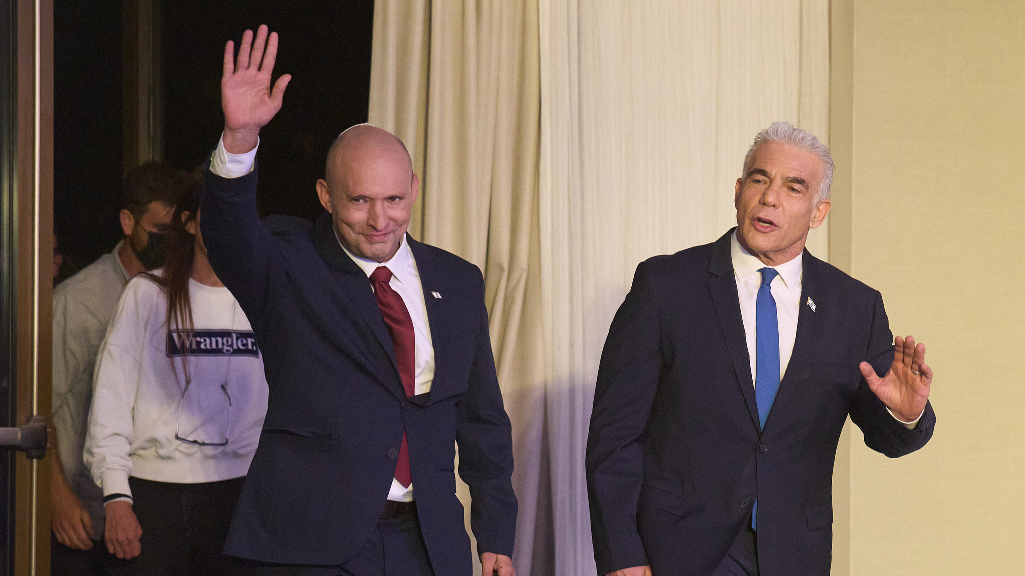 Former Israeli prime ministers Naftali Bennett, left, and Yair Lapid arrive to a joint press conference announcing that their parties will run together in the upcoming elections, in Herzliya, Israel, April 26, 2026. /VCG