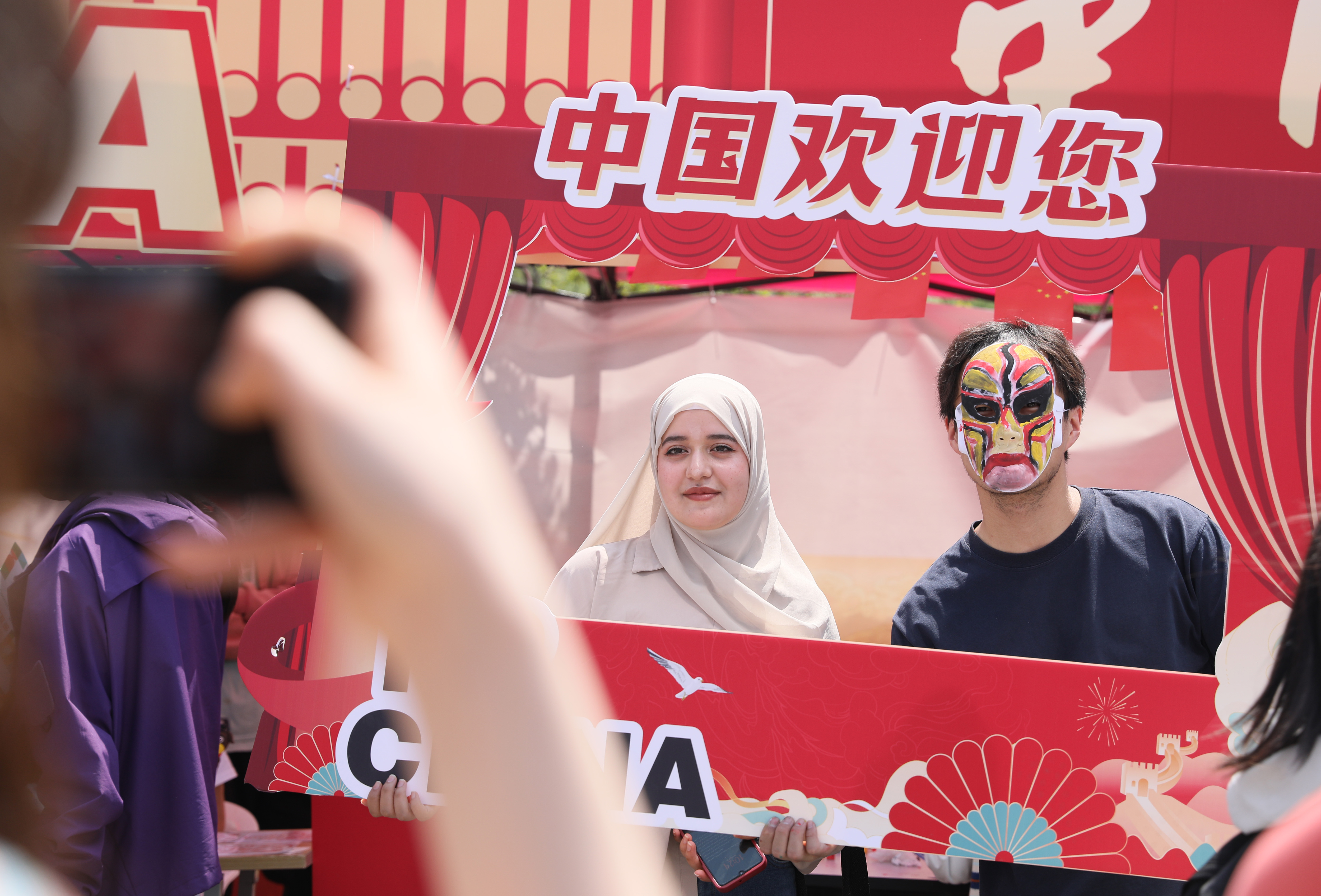 International students pose for photos at Jiangsu University's 16th International Culture Festival in Zhenjiang, east China's Jiangsu Province on April 25, 2026. /IC 