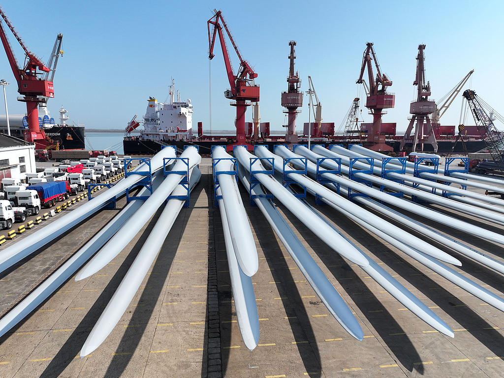 Wind turbines manufactured by a Chinese company being loaded onto ships for export at the dock of the Port of Lianyuangang in Jiangsu Province, China, April 25, 2026. /VCG