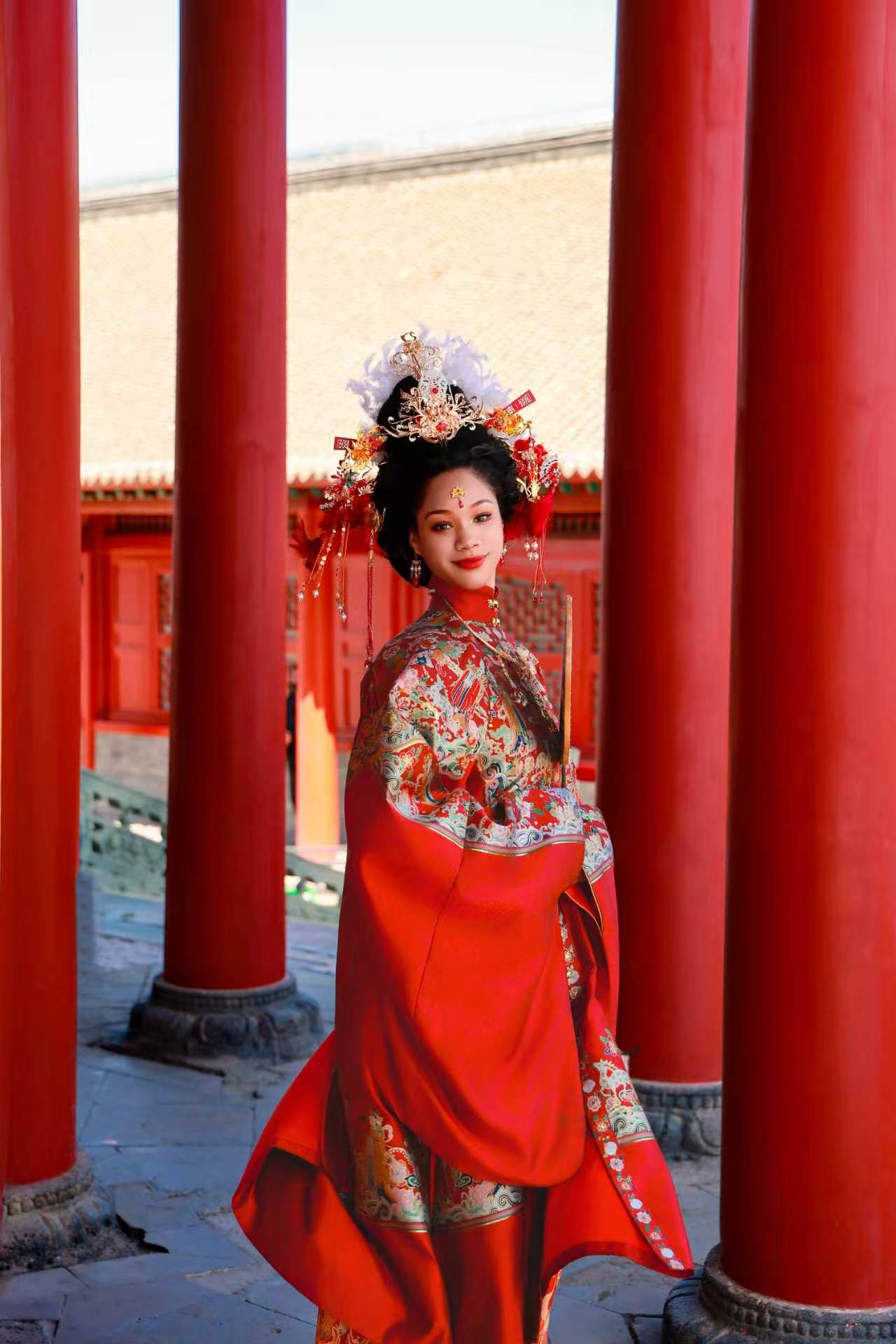 Jennifer got glammed up in traditional Chinese wear complete with a gem-studded headpiece./Jennifer Karin Pelu Fortes