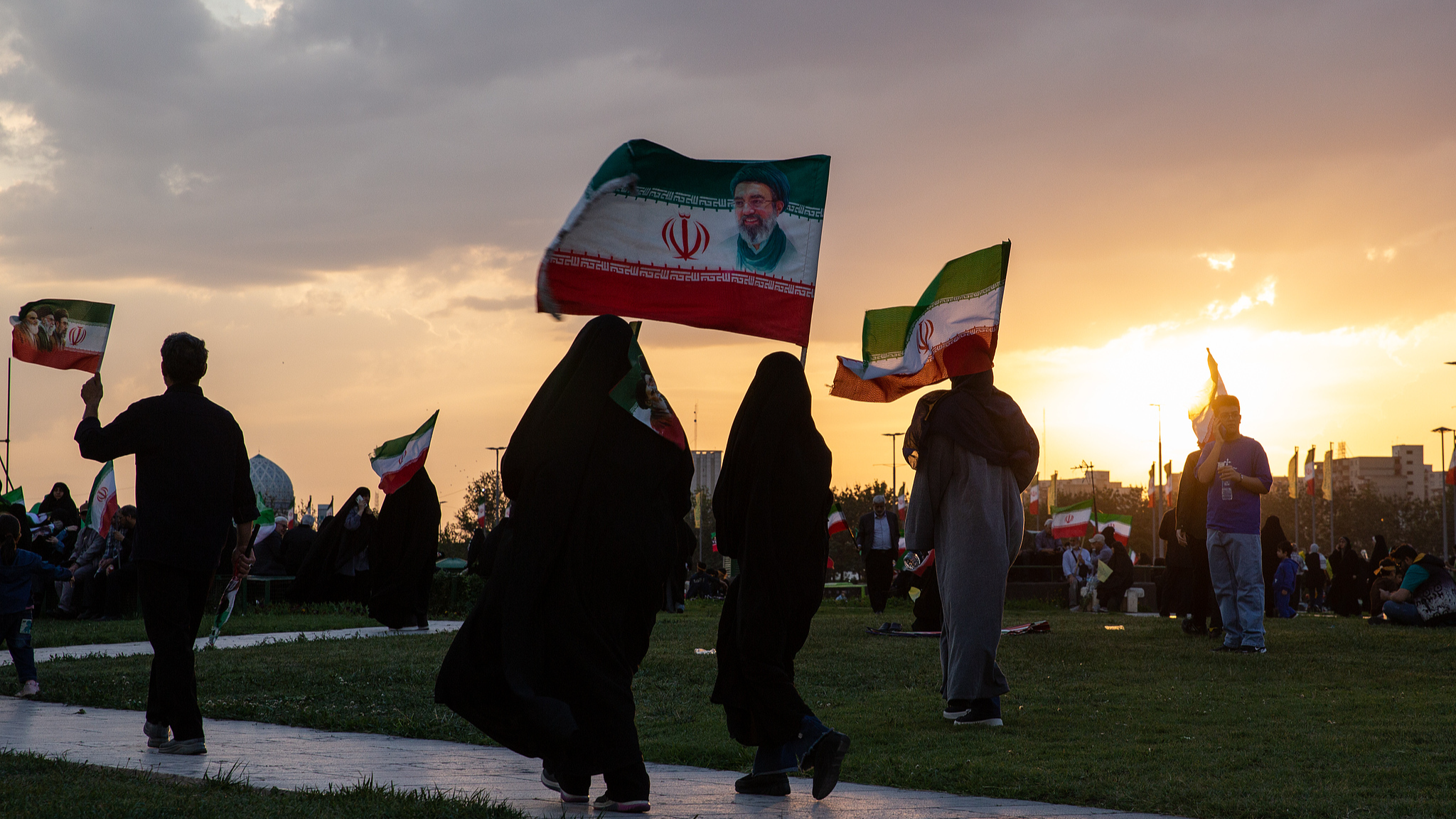 People gather in Azadi square and hold flags with the face of the new supreme leader at a march to show support for Mojtaba Khamenei in Tehran, Iran, April 29, 2026. /VCG