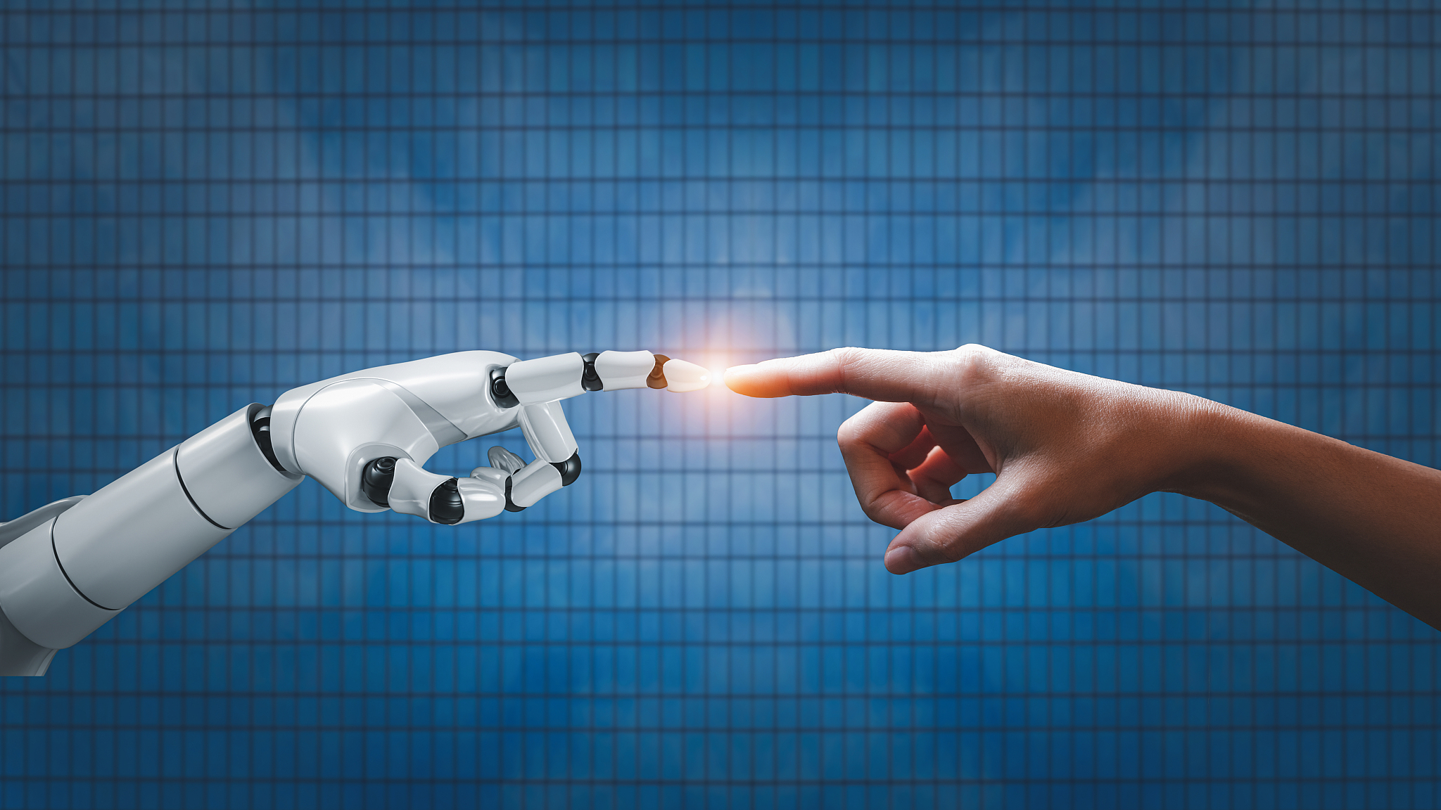  An AI robot's finger touches a human finger. /VCG