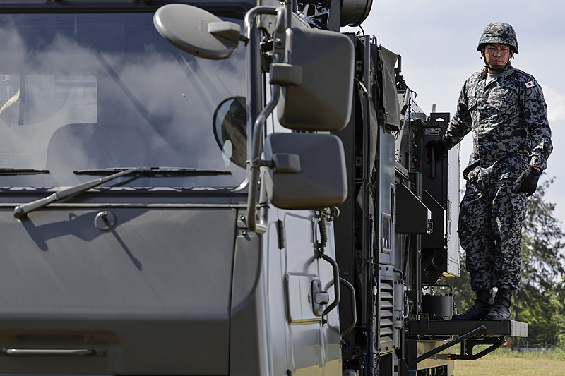 An officer of the Japan Air Self-Defense Force stands beside a fire control system during a Philippines-United States Balikatan joint military exercise at a Philippine Navy Camp in San Antonio, a town in Zambales Province, the Philippines, April 28, 2026. /CFP