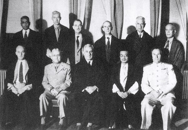 The 11 judges of the International Military Tribunal for the Far East, photographed in Tokyo on July 29, 1946. Seated, from left: William Donald Patrick, United Kingdom; Myron C. Cramer, United States; Sir William Webb, Australia; Mei Ruao, China; and Ivan M. Zaryanov, Soviet Union. Standing, from left: Radhabinod Pal, India; B. V. A. Röling, Netherlands; Edward Stuart McDougall, Canada; Henri Bernard, France; Erima Harvey Northcroft, New Zealand; and Delfin Jaranilla, Philippines. Cramer had replaced John P. Higgins as the US judge earlier that year. /VCG