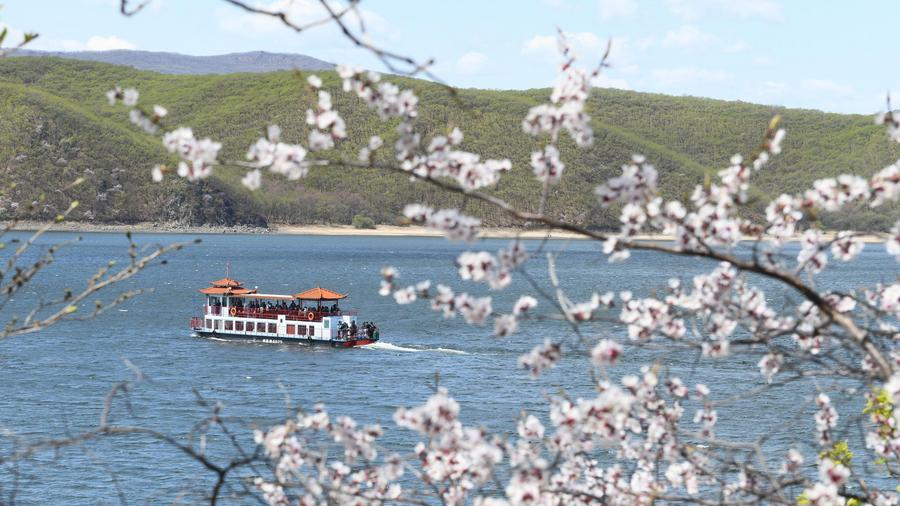 Tourists enjoy the scenery from a boat on Jingbo Lake in Mudanjiang, a city in Heilongjiang Province, northeast China, May 2, 2026. /Xinhua
