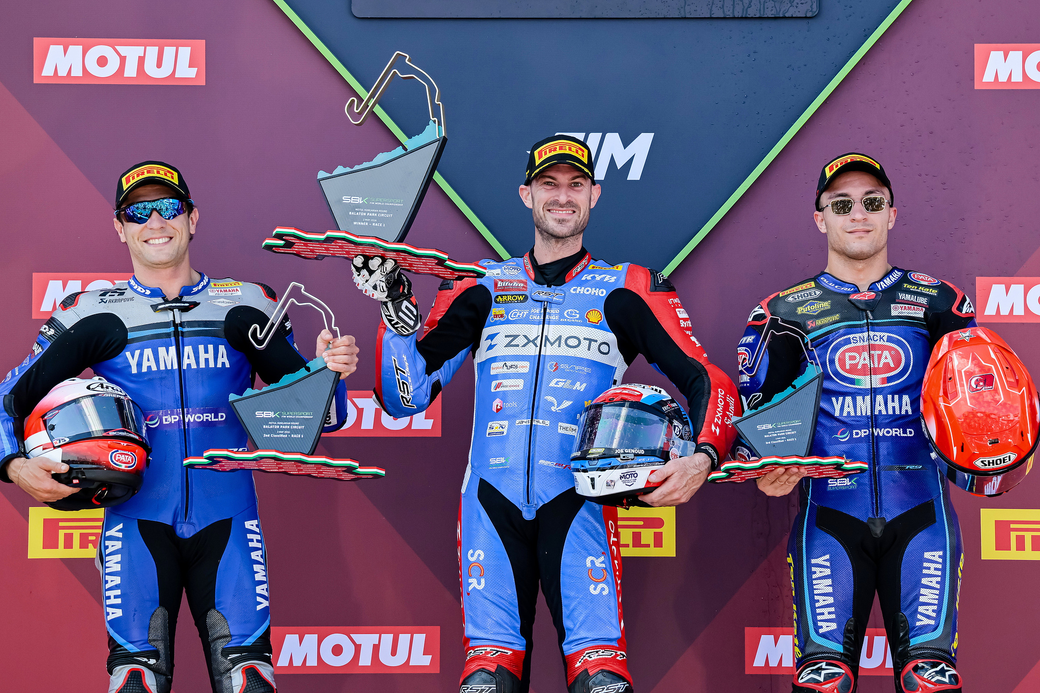 L-R: Runner-up Albert Arenas of AS BLU CRU Racing Team, champion Valentin Debise of ZXMOTO and third-placed Can Oncu of Pata Yamaha Ten Kate Racing pose on the podium after competing in Race 1 of the FIM Supersport World Championship at the Balaton Park Circuit in Balatonfokajar, Hungary, May 2, 2026. /VCG