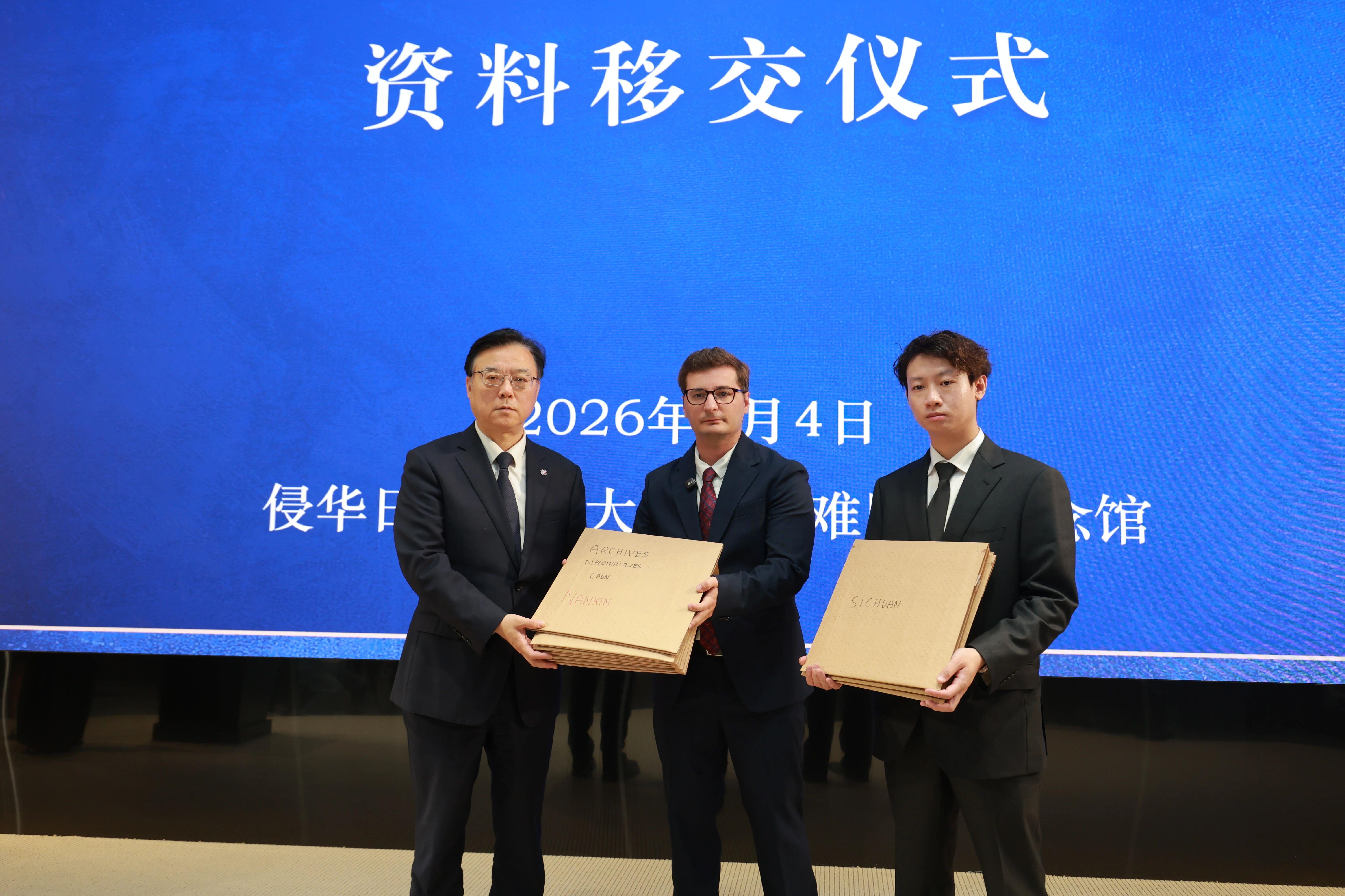 The ceremony for the handover of archives recording Japan's wartime aggression in China during World War II donated by Bastien Ratat and Zhong Haosong, Nanjing, Jiangsu Province, east China, May 4, 2026. /CMG