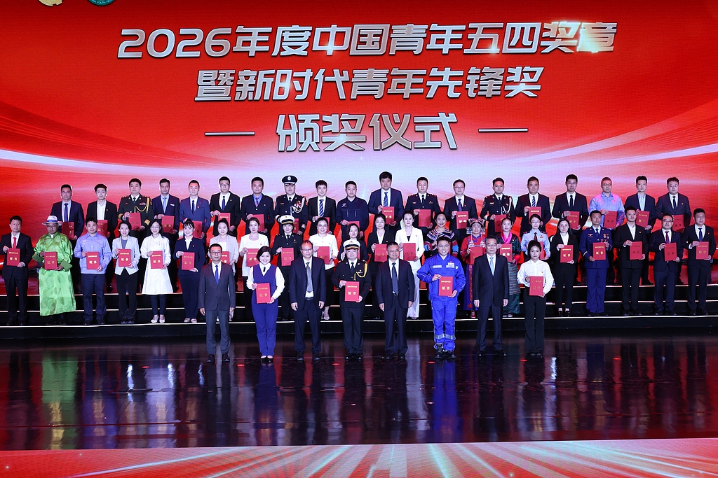 Awardees pose for a group photo during the 2026 China Youth May Fourth Medal and the New Era Youth Pioneer awards ceremony in Beijing, China, April 27, 2026. /VCG