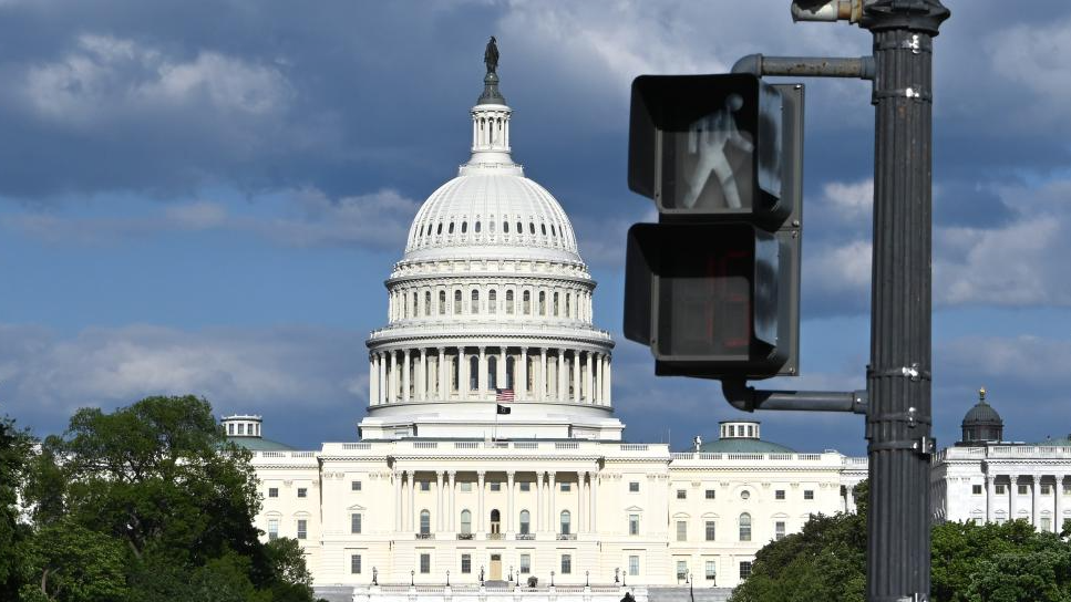 The US Capitol building behind a pedestrian light in Washington, DC, the United States, April 30, 2026. /Xinhua