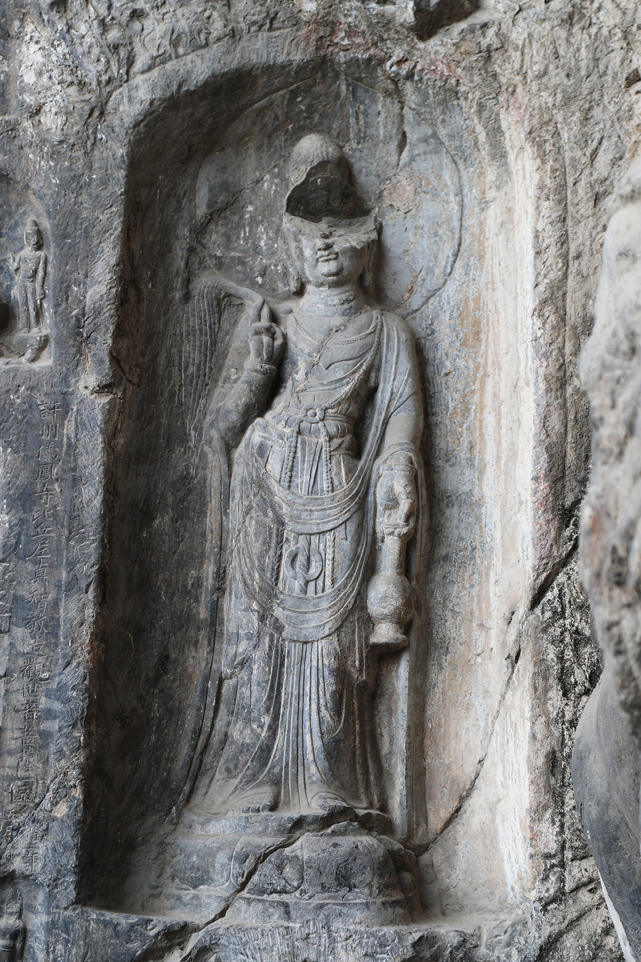 A statue of Guanyin, the Goddess of Mercy, is seen in a niche at the Longmen Grottoes in Luoyang, Henan Province. /CGTN
