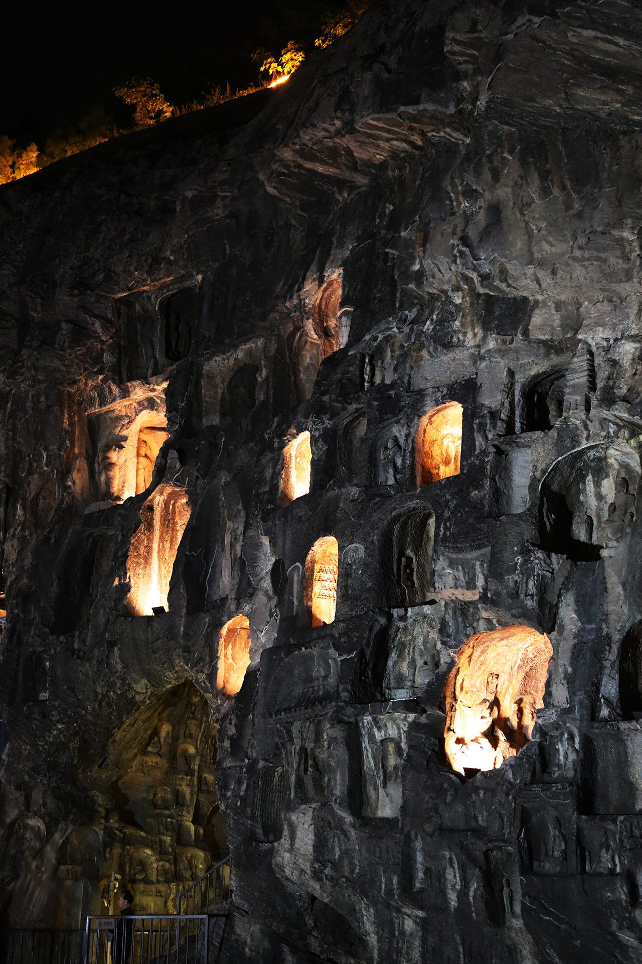 Niches are illuminated at night at the Longmen Grottoes in Luoyang, Henan Province. /CGTN