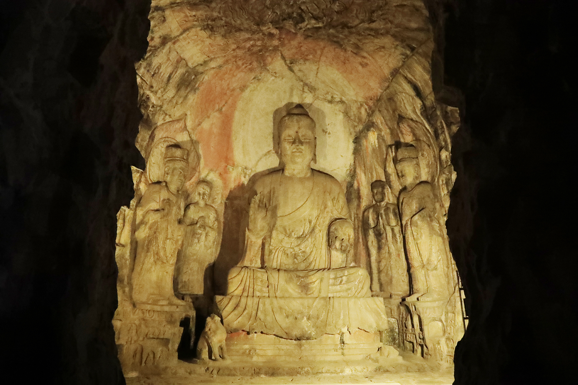 Statues in a cave are illuminated at night at the Longmen Grottoes in Luoyang, Henan Province. /CGTN