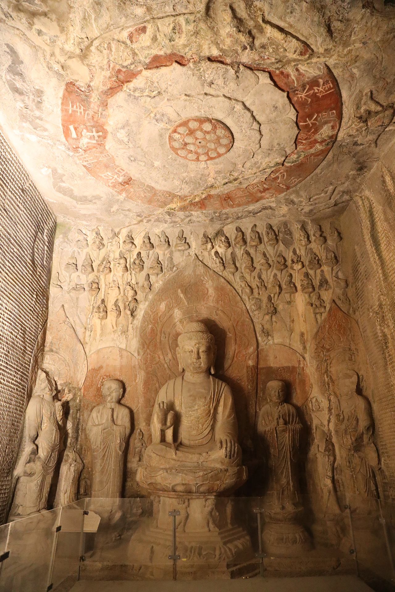 Statues in a cave are illuminated at night at the Longmen Grottoes in Luoyang, Henan Province. /CGTN
