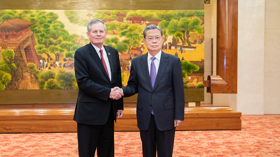 Zhao Leji, chairman of the Standing Committee of the National People's Congress (NPC), shakes hands with US senator Steve Daines in Beijing, China, May 7, 2026. /Xinhua