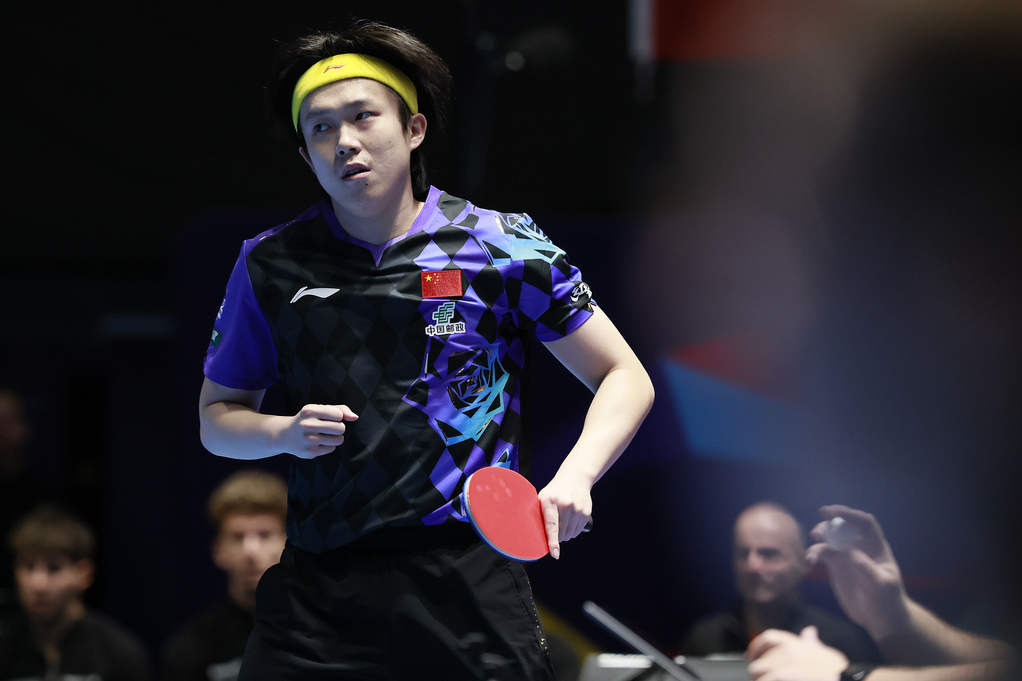 Wang Chuqin of China reacts after winning the singles match against Iulian Chirita of Romania during the men's teams round of 16 match between China and Romania at the ITTF World Team Table Tennis Championships Finals in London, England, May 6, 2026. /VCG