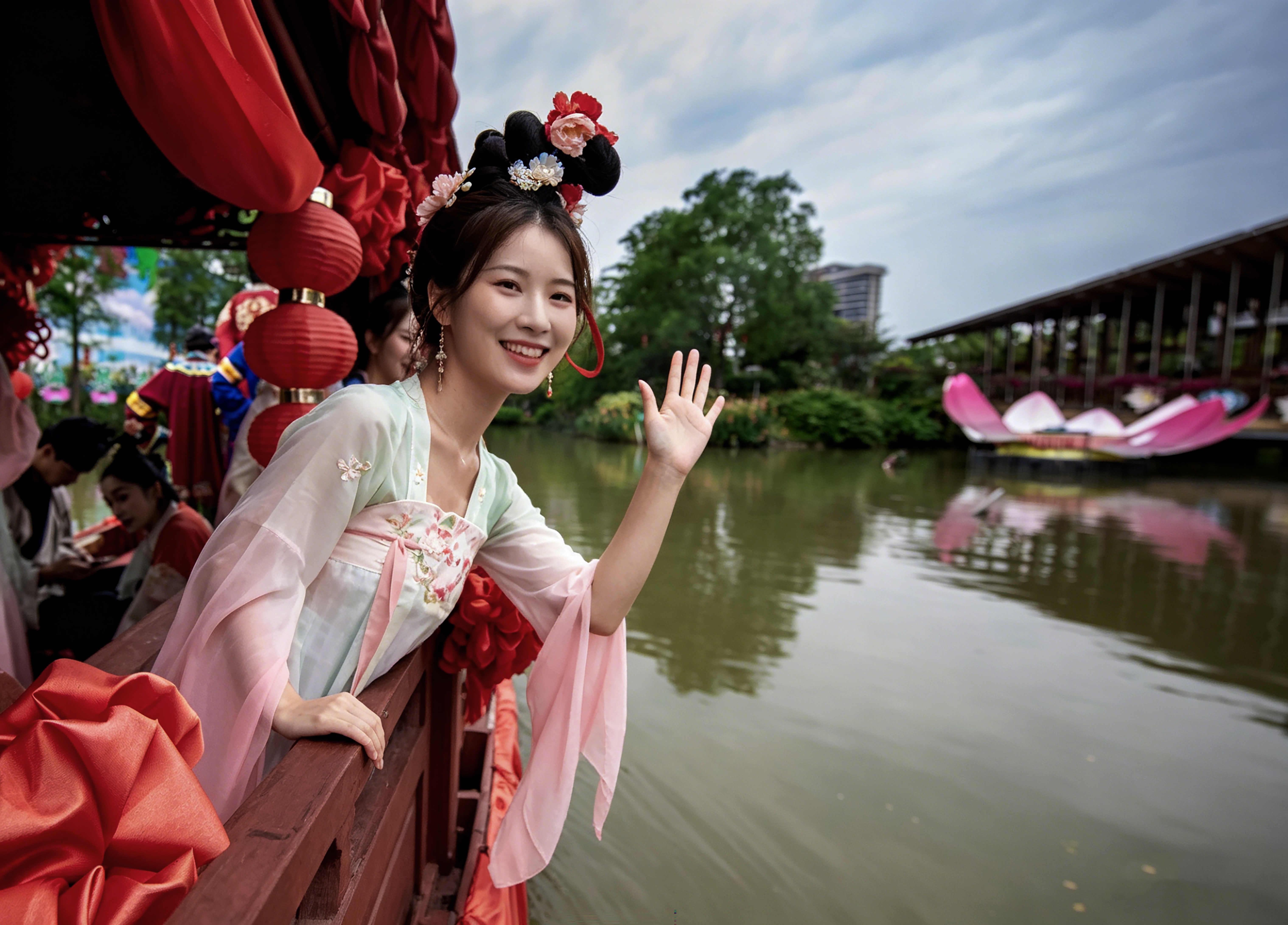 A bridesmaid poses for photos during a water wedding performance at Gulao Water Town in Heshan City, south China's Guangdong Province on May 4, 2026. /IC