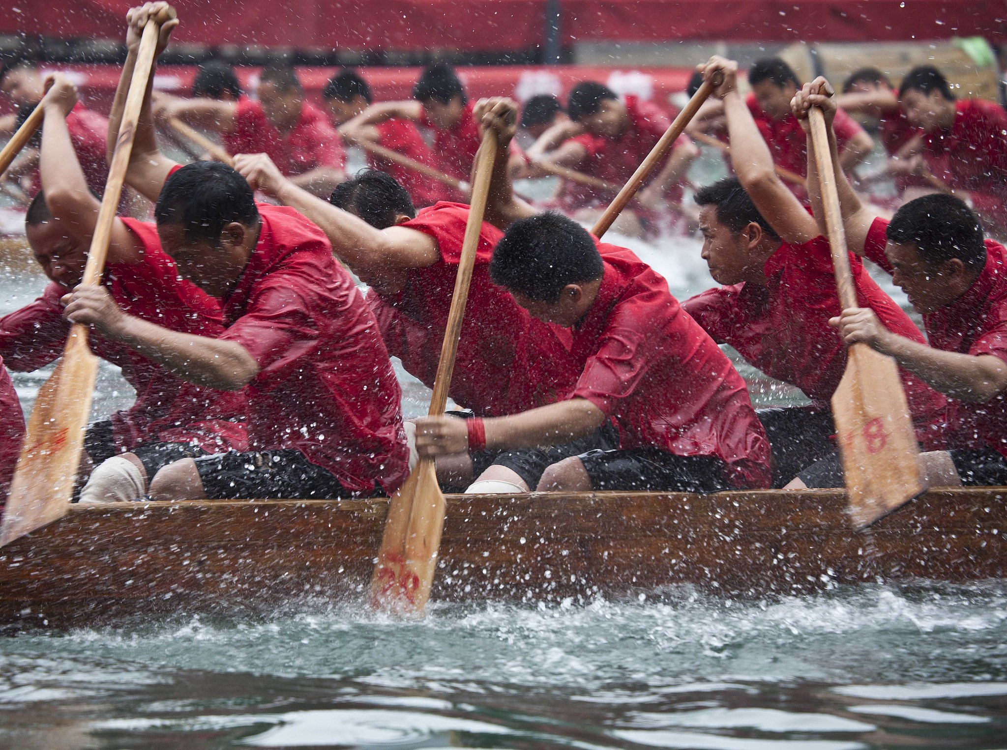 A dragon boats race in Zhenyuan, Guizhou. /VCG