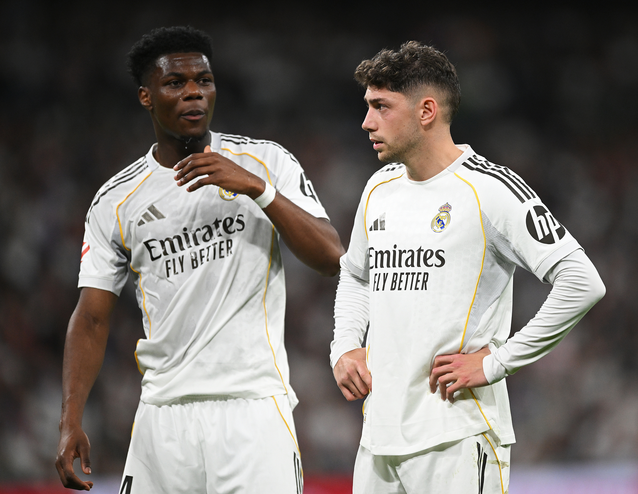 Aurelien Tchouameni (L) and Federico Valverde of Real Madrid look on during the La Liga match between Real Madrid and Girona at Estadio Santiago Bernabeu in Madrid, Spain, April 10, 2026. /VCG