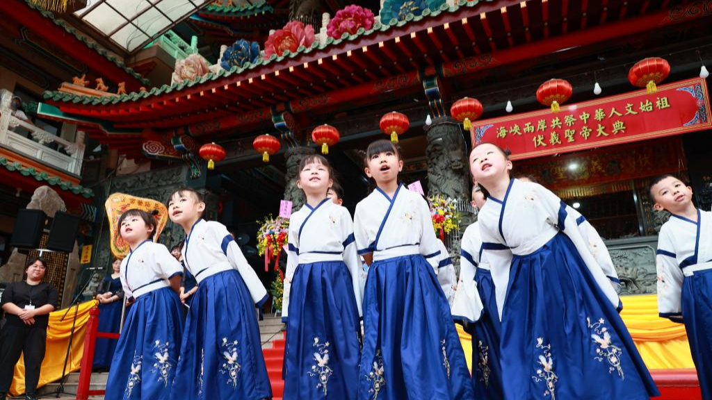 Children perform at a ceremony worshiping Fuxi in New Taipei City, southeast China's Taiwan, June 21, 2025. /Xinhua
