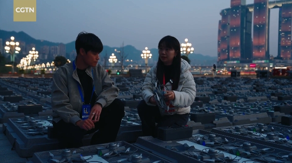 Drone swarm flight planners prepare for a drone light show in Chongqing. /CGTN