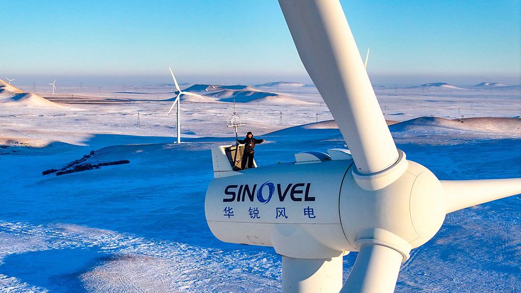 An engineer inspects wind turbine equipment in north China's Inner Mongolia Autonomous Region, January 17, 2025. /VCG
