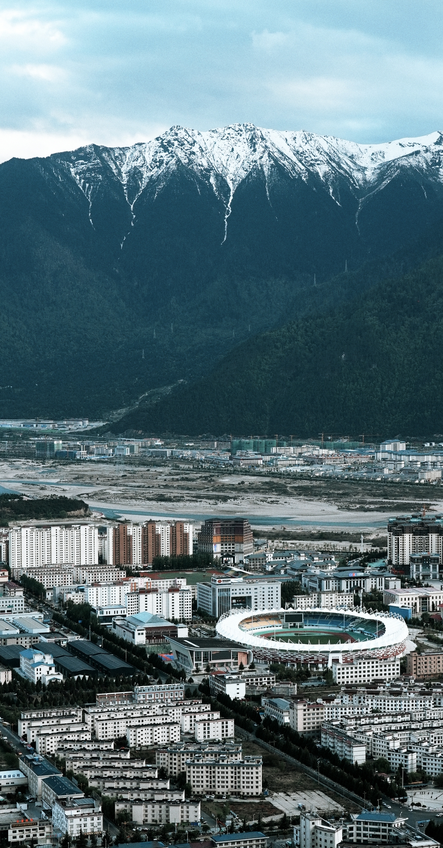 Snow-capped peaks rise above ancient forests and glaciers in Nyingchi, where high-altitude landscapes have earned it the nickname 