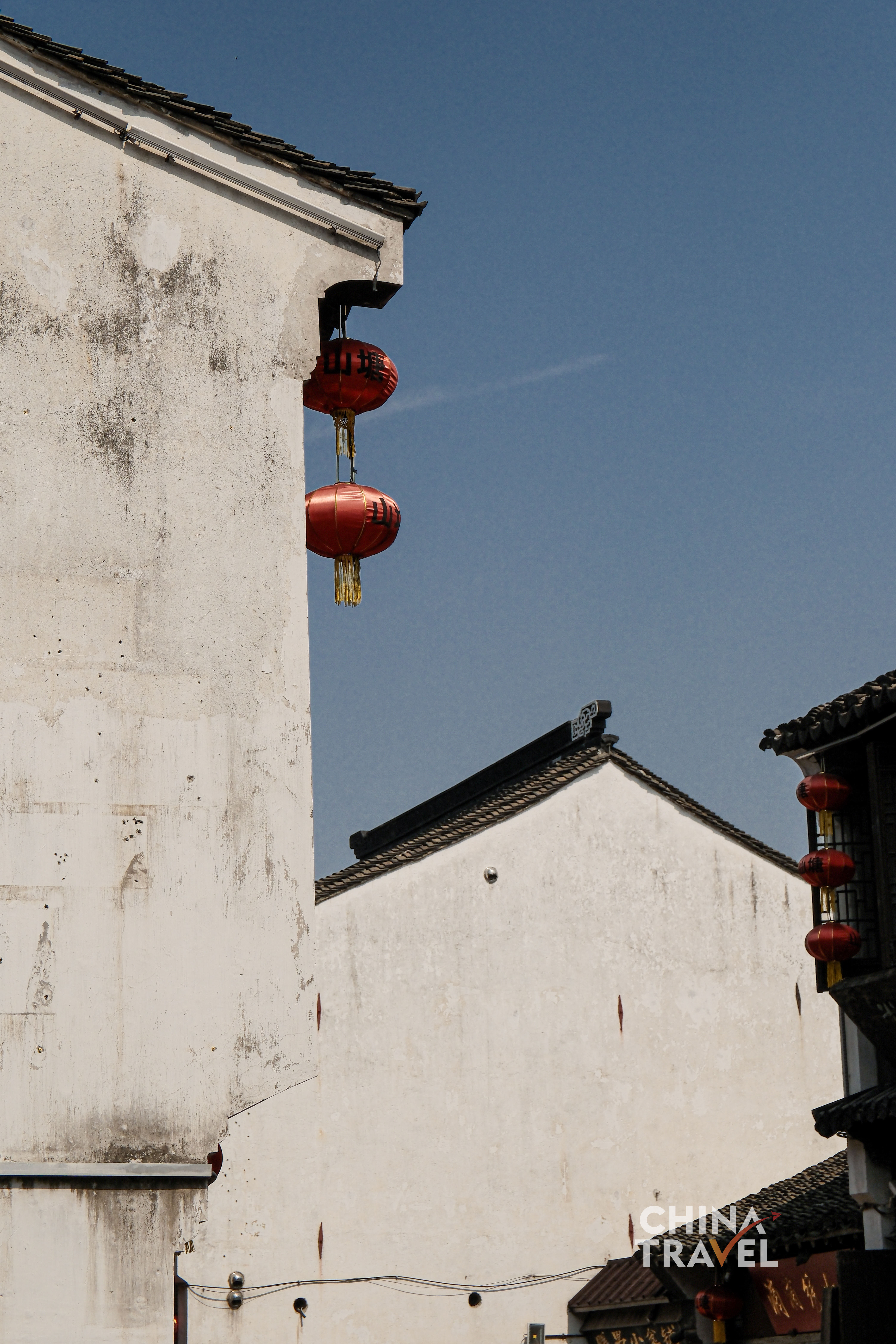 Whitewashed walls and dark tiled roofs define Suzhou's architectural language, where restraint and proportion create a quiet visual order. /CGTN
