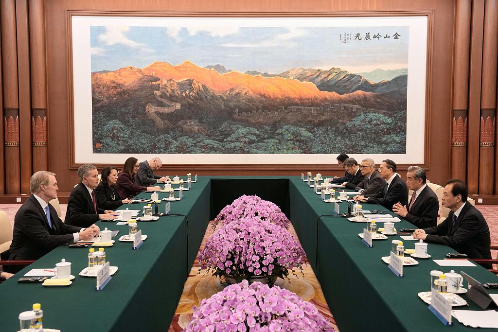 Chinese Foreign Minister Wang Yi, second right, talks to US Senator Steve Daines, second left, during a bilateral meeting with a US congressional delegation at the Great Hall of the People in Beijing, China, May 7, 2026. /CFP
