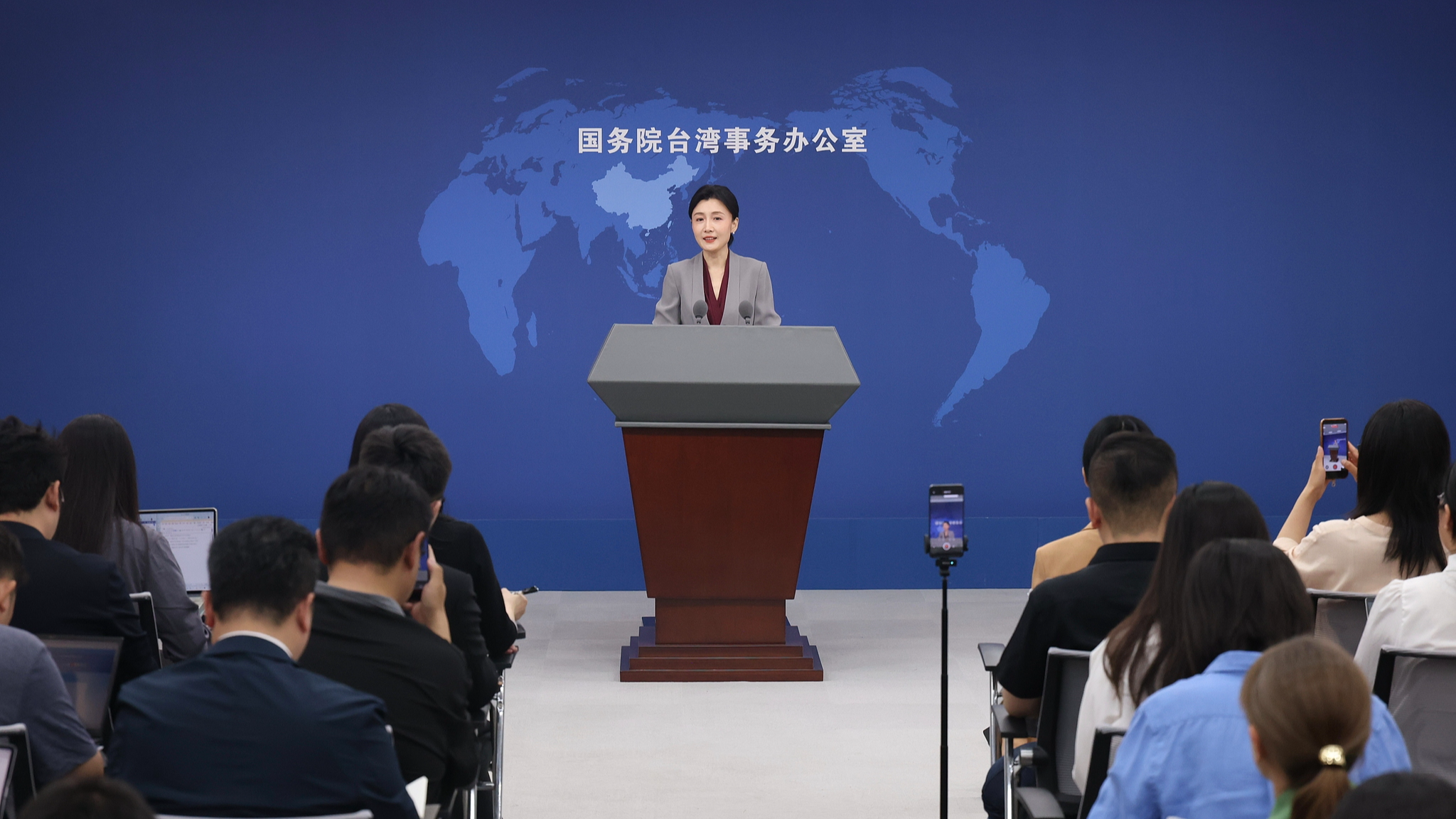 Zhang Han, a spokesperson for the State Council Taiwan Affairs Office, answers questions at a press briefing on May 13, 2026. /VCG