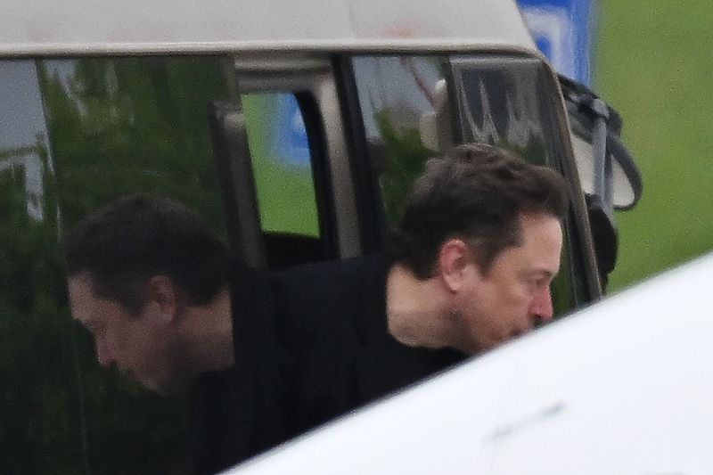 Tesla CEO Elon Musk gets off a minibus before boarding his private plane at Beijing airport on April 29, 2024. /VCG