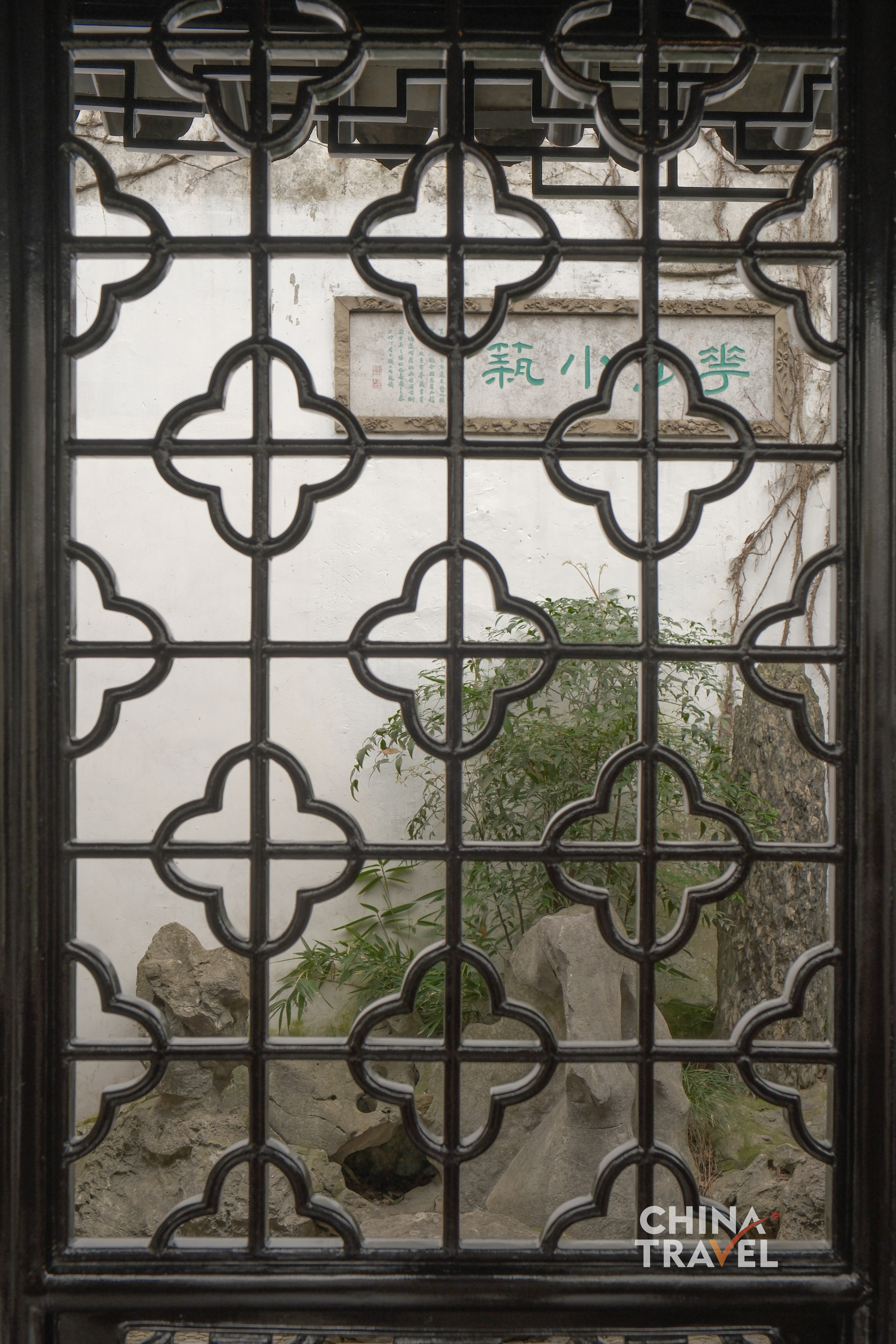 Geometric windows frame the garden into composed scenes, turning nature into a series of living pictures. /CGTN