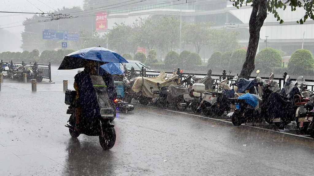 A rider travels through heavy rain in Guangzhou, south China's Guangdong Province, May 15, 2026. /VCG