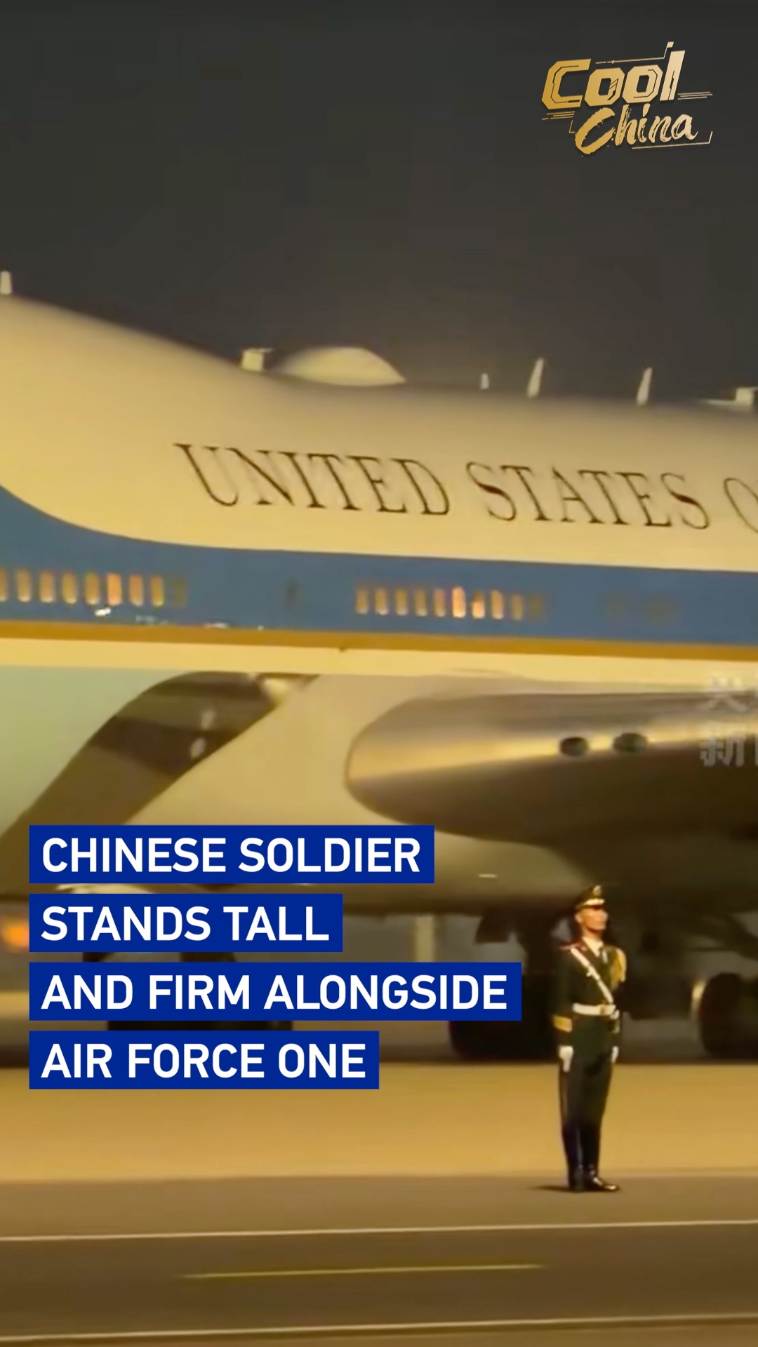 Chinese soldier stands tall and firm alongside Air Force One
