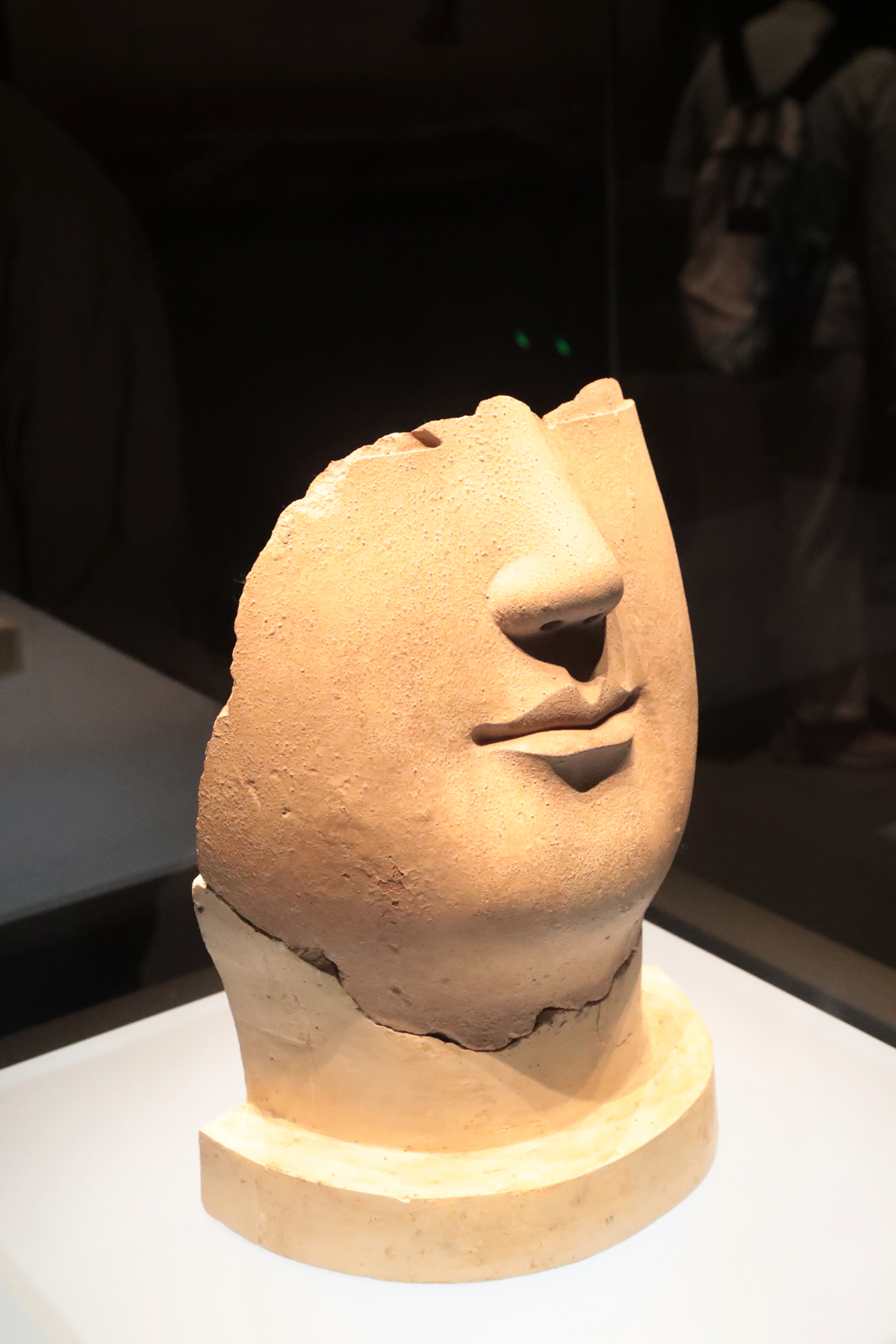 A partially preserved face of a clay Buddha statue from the Northern Wei Dynasty is on display at the Luoyang Museum in Henan Province. /CGTN