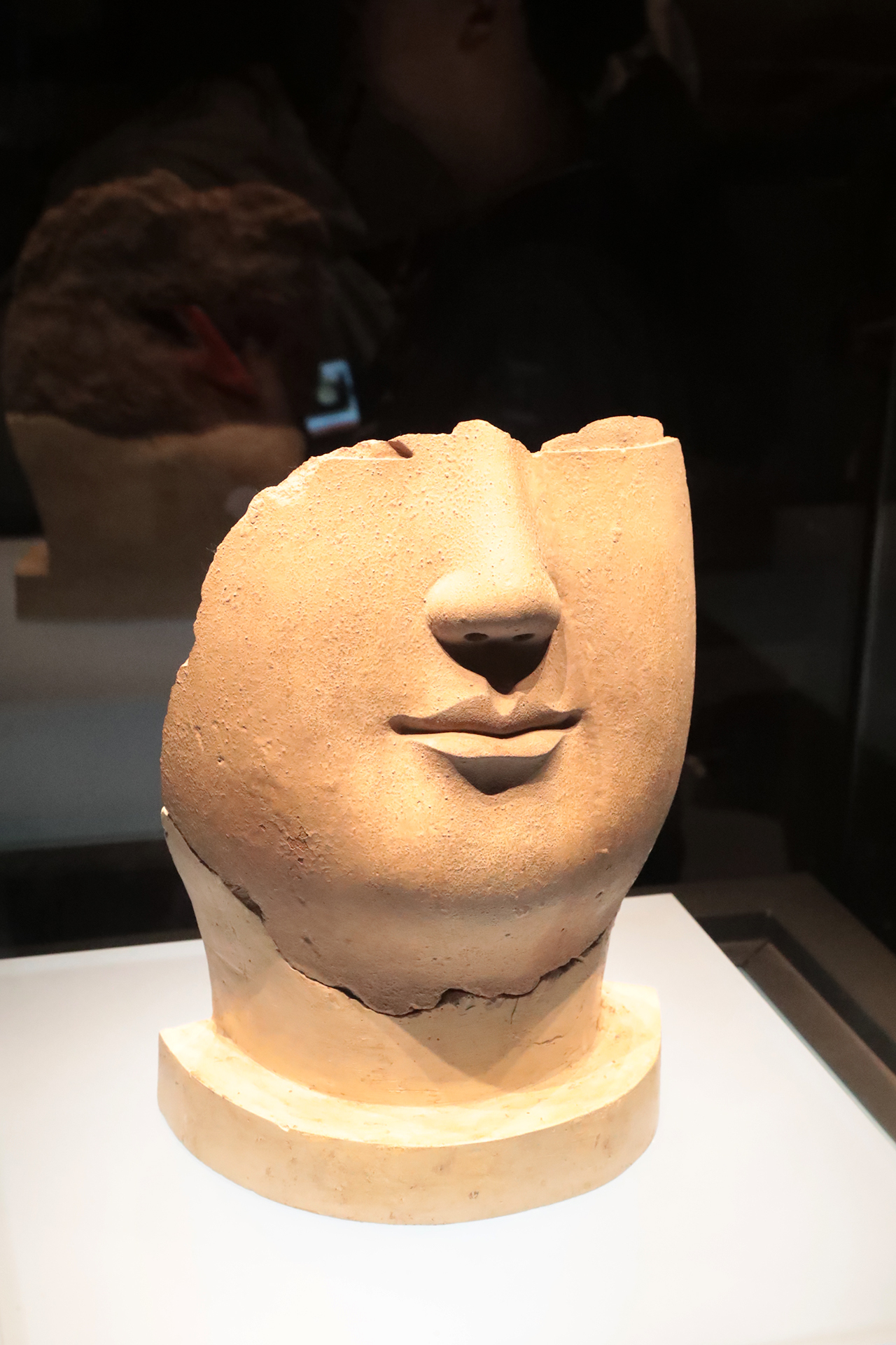 A partially preserved face of a clay Buddha statue from the Northern Wei Dynasty is on display at the Luoyang Museum in Henan Province. /CGTN