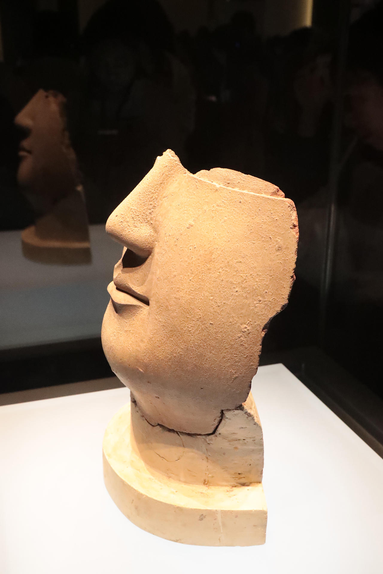 A partially preserved face of a clay Buddha statue from the Northern Wei Dynasty is on display at the Luoyang Museum in Henan Province. /CGTN