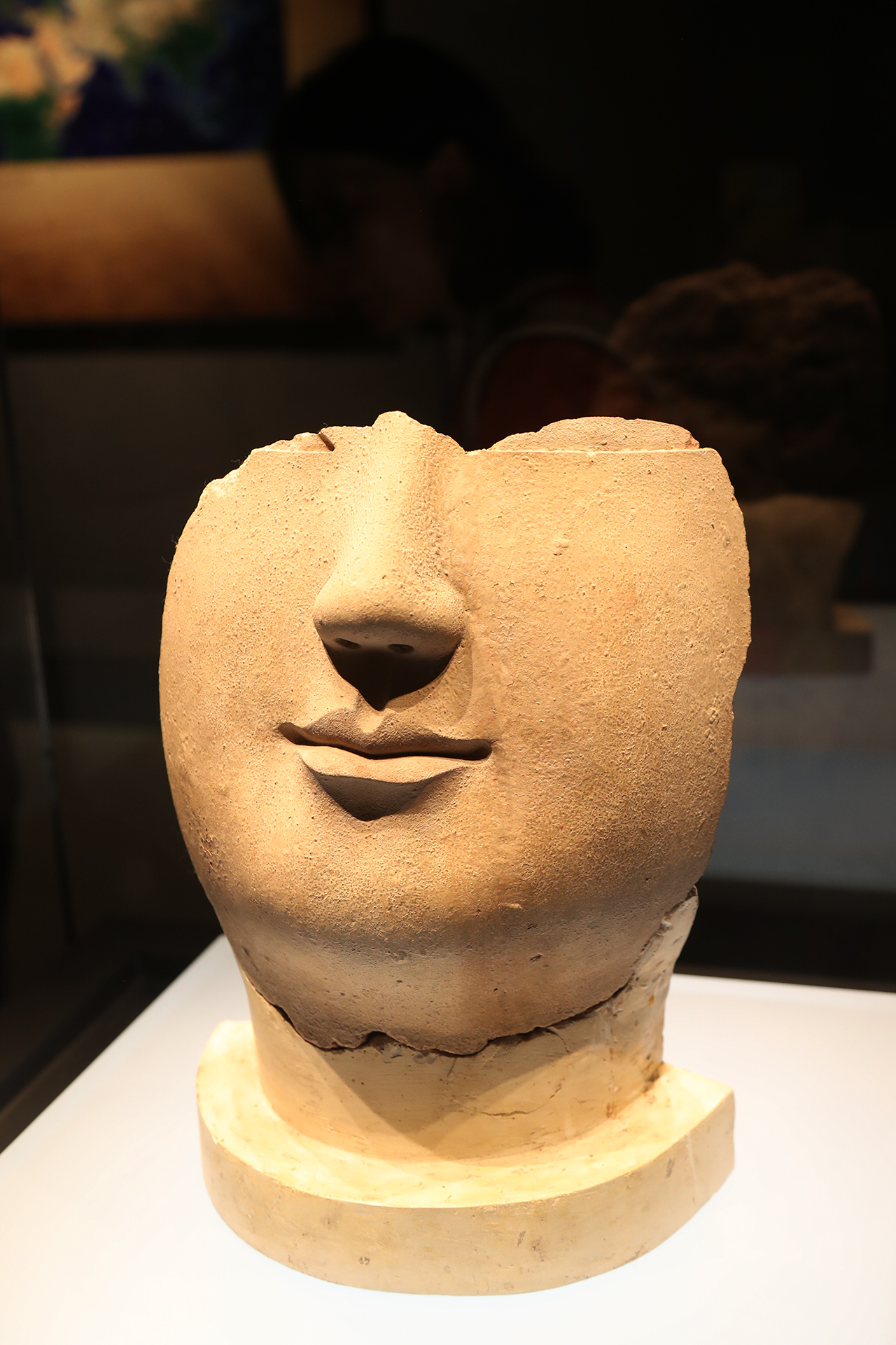 A partially preserved face of a clay Buddha statue from the Northern Wei Dynasty is on display at the Luoyang Museum in Henan Province. /CGTN