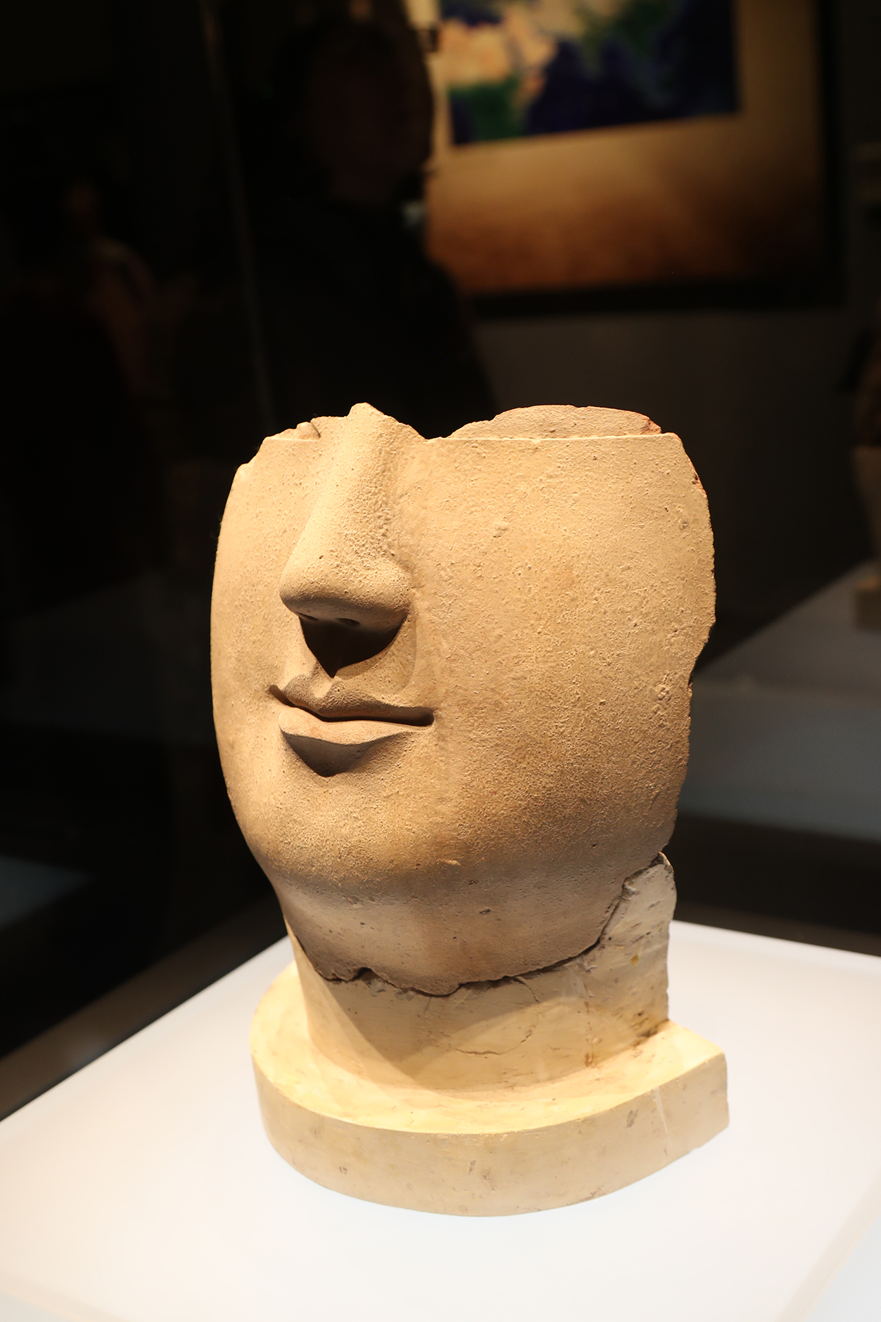 A partially preserved face of a clay Buddha statue from the Northern Wei Dynasty is on display at the Luoyang Museum in Henan Province. /CGTN
