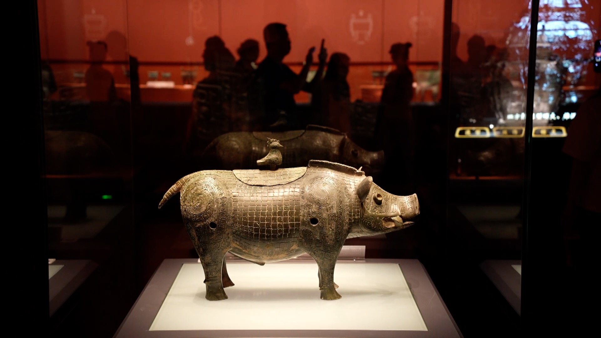 A pig-shaped bronze wine vessel is seen at the 