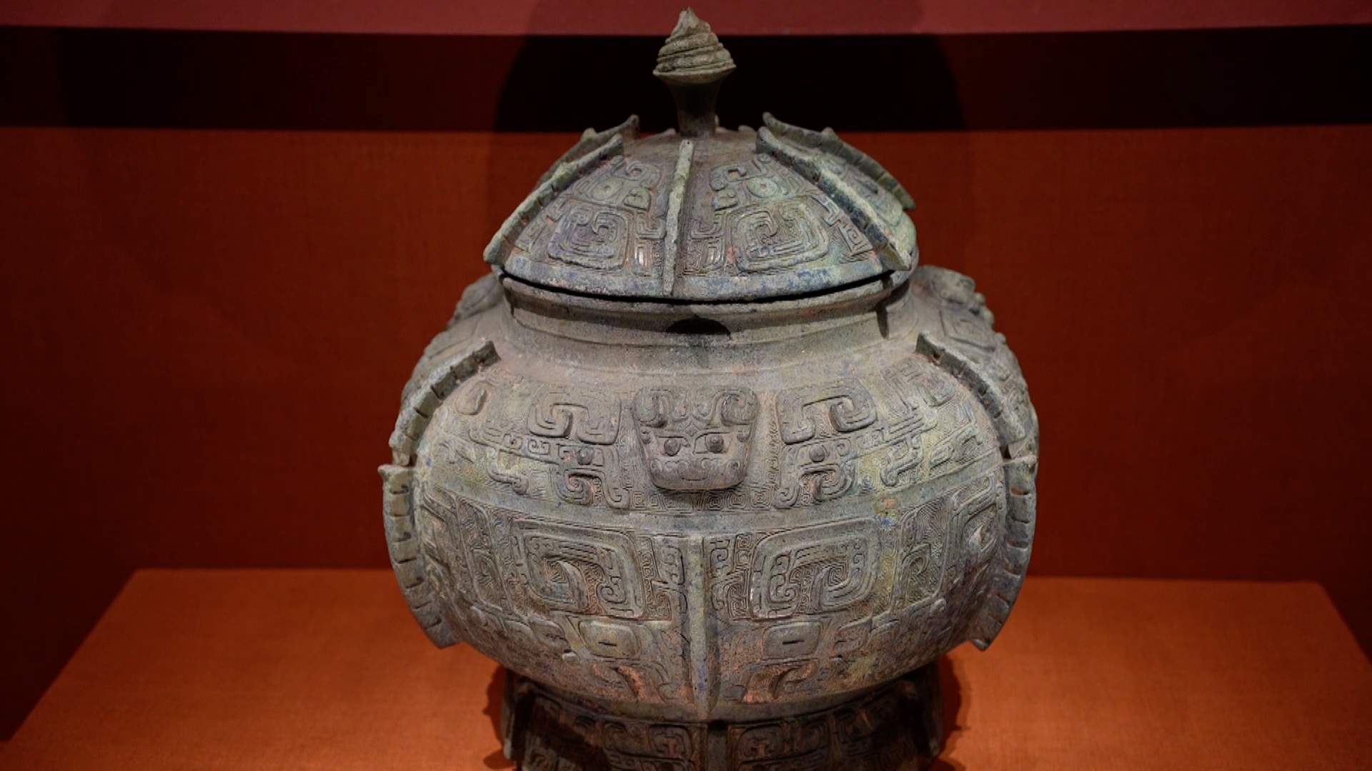 A bronze Bu vessel with Taotie mask patterns is seen at the 