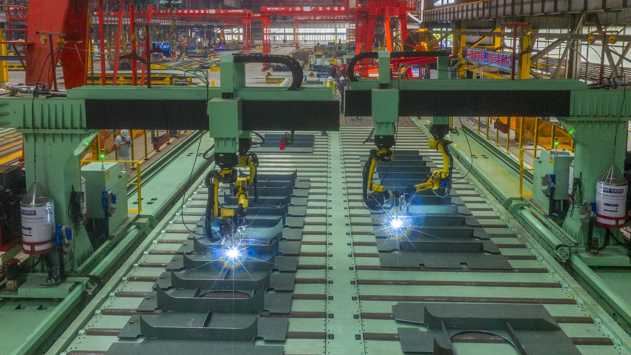 Welding robots work at a shipyard in Dongguan City, south China's Guangdong Province, May 17, 2026. /VCG