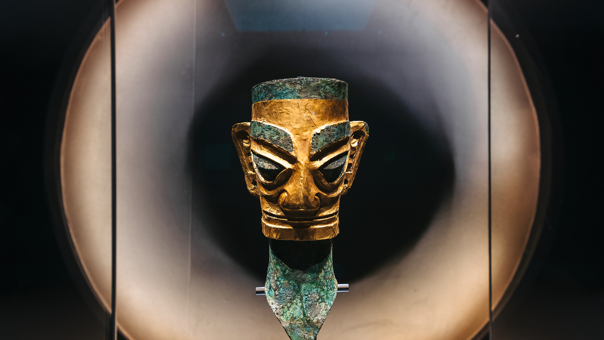 Profile photo of a bronze human head mask with a gold face, unearthed at the Sanxingdui site in Guanghan, Sichuan, January 11, 2022. /CFP