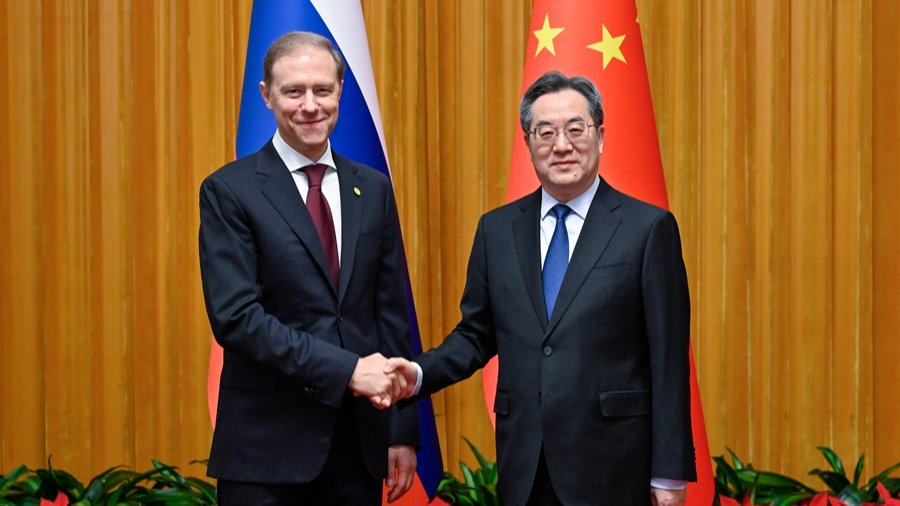 Chinese Vice Premier Ding Xuexiang (R), also a member of the Standing Committee of the Political Bureau of the Communist Party of China Central Committee, meets with Russian First Deputy Prime Minister Denis Manturov in Beijing, China, May 19, 2026. /Xinhua