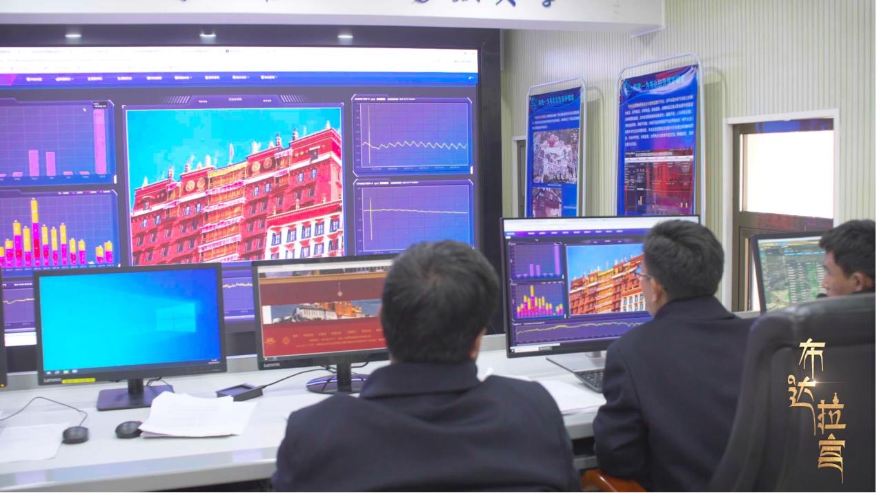 Staff members at the Potala Palace Heritage Monitoring Center check real-time monitoring data. /CGTN