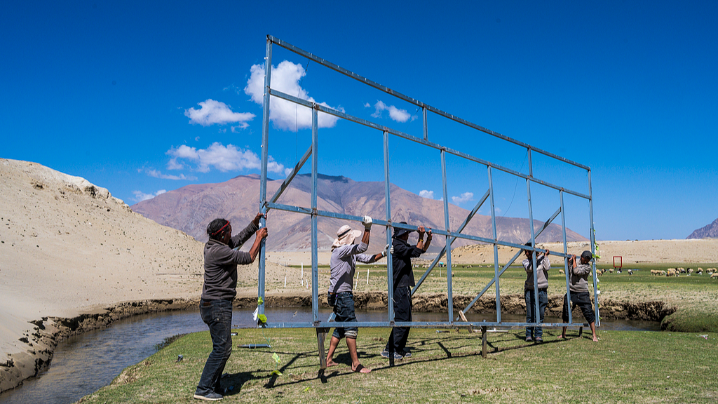 People preparing for the upcoming summer tourism peak season in the Shaha Oasis of Dingri County, Xigaze, southwest China's Xizang Autonomous Region, on May 21, 2026. /VCG