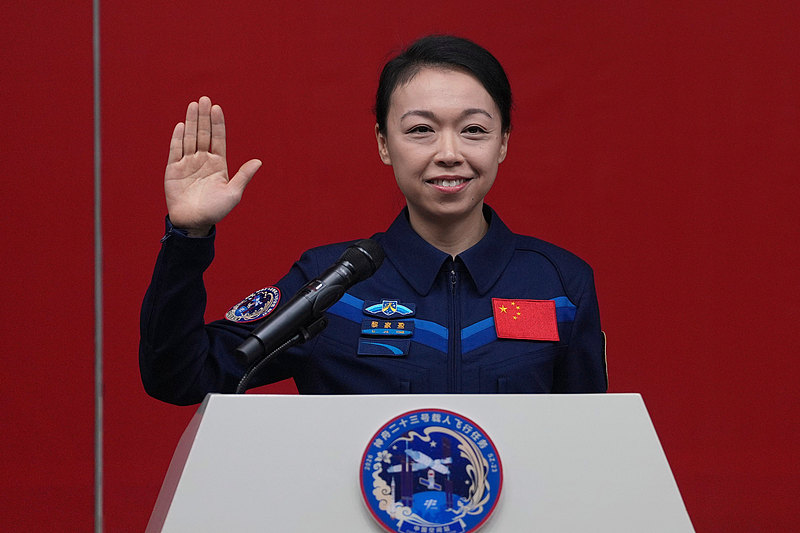 Hong Kong astronaut Lai Ka-ying waves during a press conference ahead of the Shenzhou-23 manned mission at the Jiuquan Satellite Launch Center in Jiuquan, northwestern China, May 23, 2026. /VCG