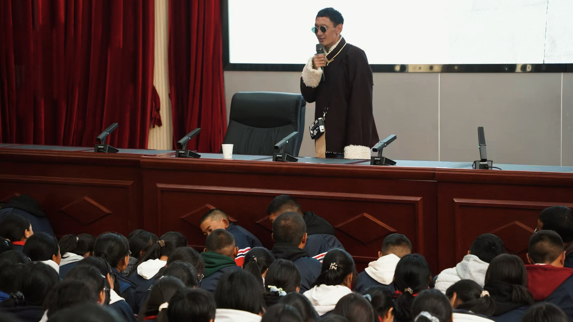 Nyima Wangdu giving a speech at a school in Lhasa, Xizang, China, May 7, 2026. /CGTN