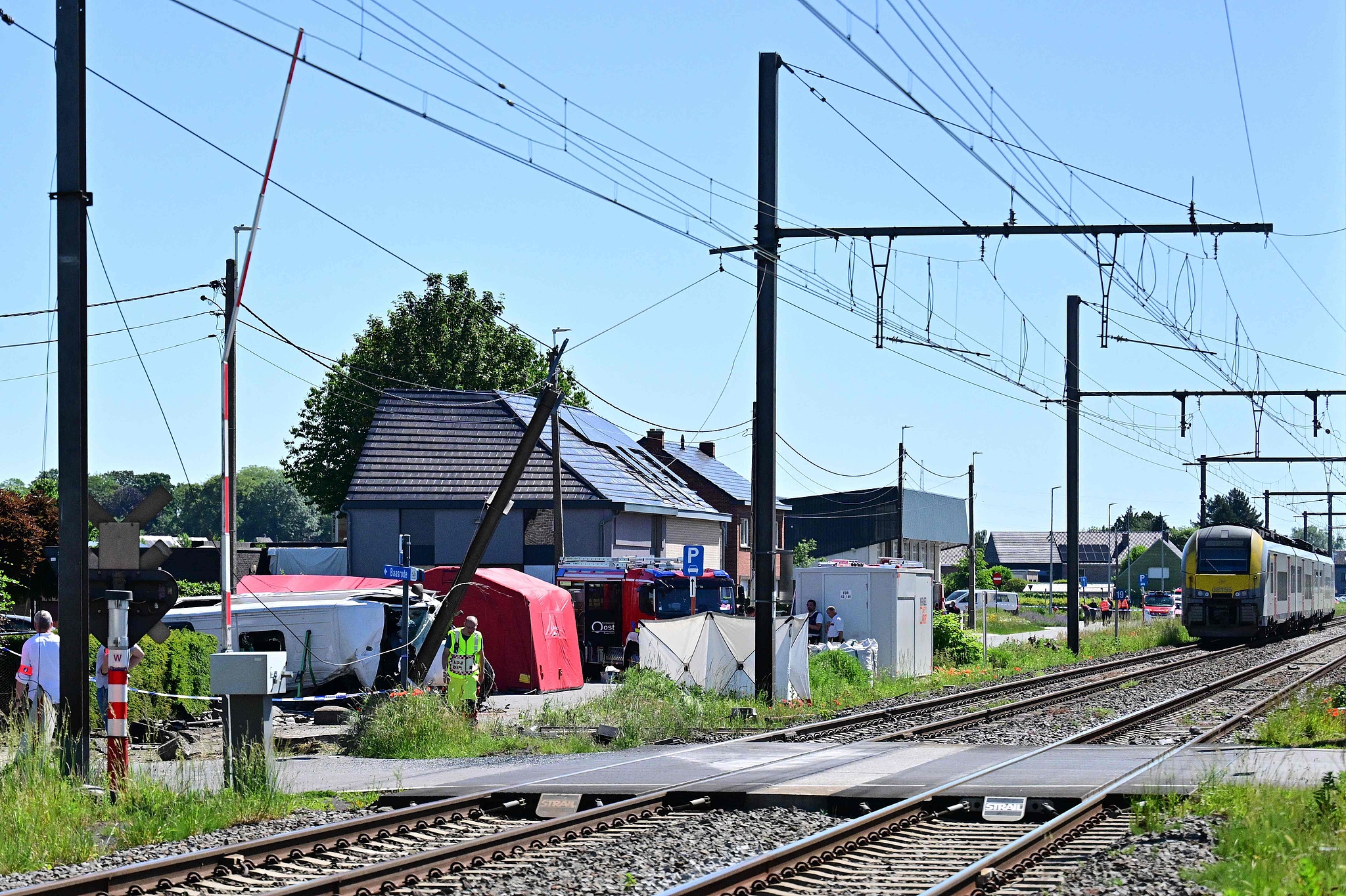 The site of the collision between a train and a school bus at a railway crossing in Buggenhout, Belgium, May 26, 2026. /VCG