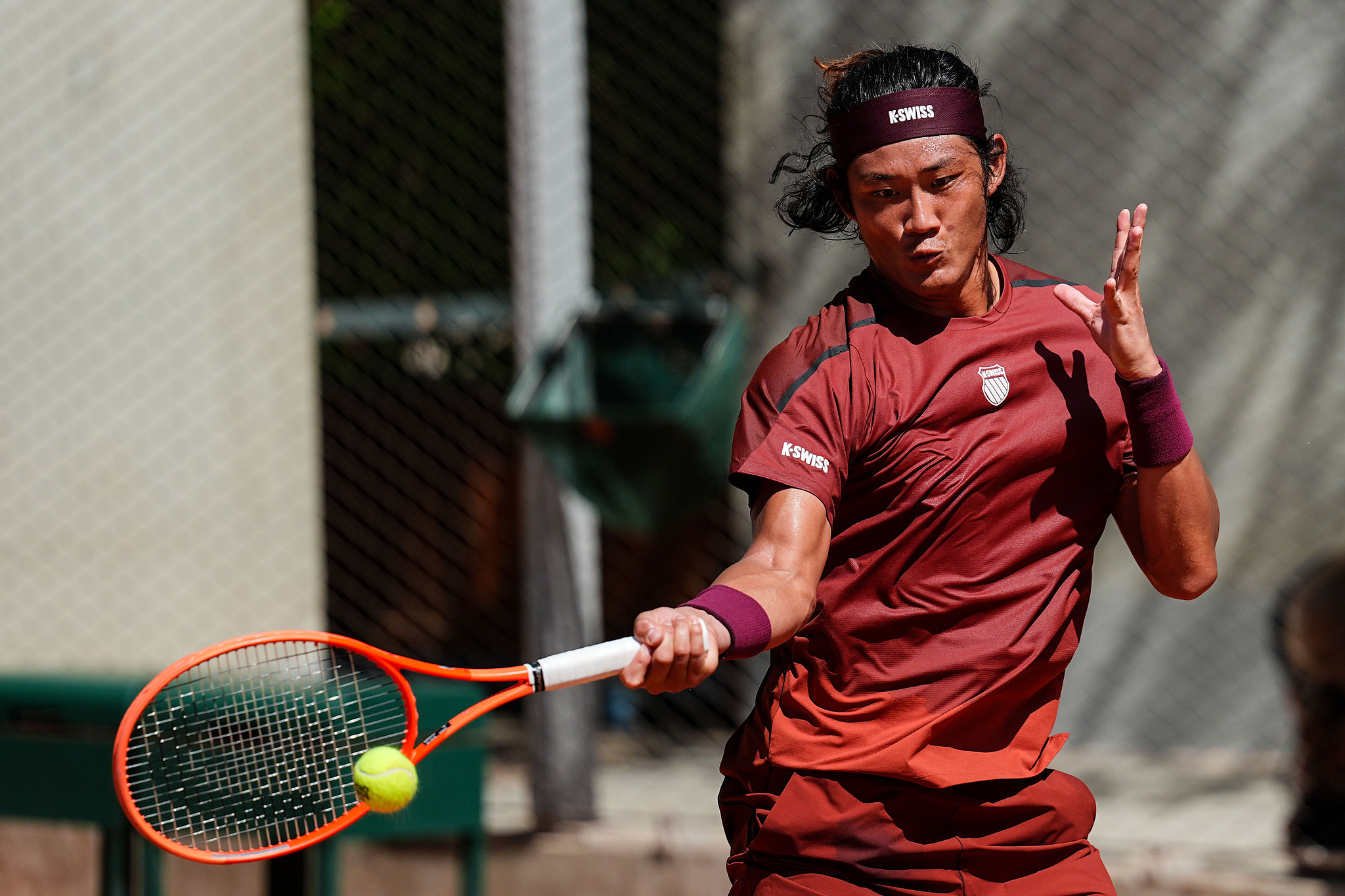 Zhang Zhizhen of China hits a shot in the men's singles first round against Facundo Diaz Acosta of Argentina at the French Open at Roland Garros in Paris, France, May 26, 2026. /VCG